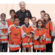 Ed Snider and students from his Youth Hockey & Education program.