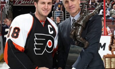Mike Richards poses with Paul Holmgren holding the Bobby Clarke Trophy. (Credit: Flyers PR)
