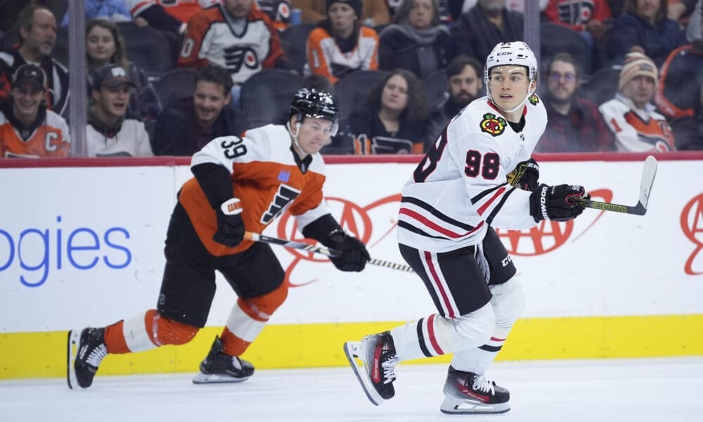 Philadelphia Flyers forward Matvei Michkov pursues Chicago Blackhawks forward Connor Bedard