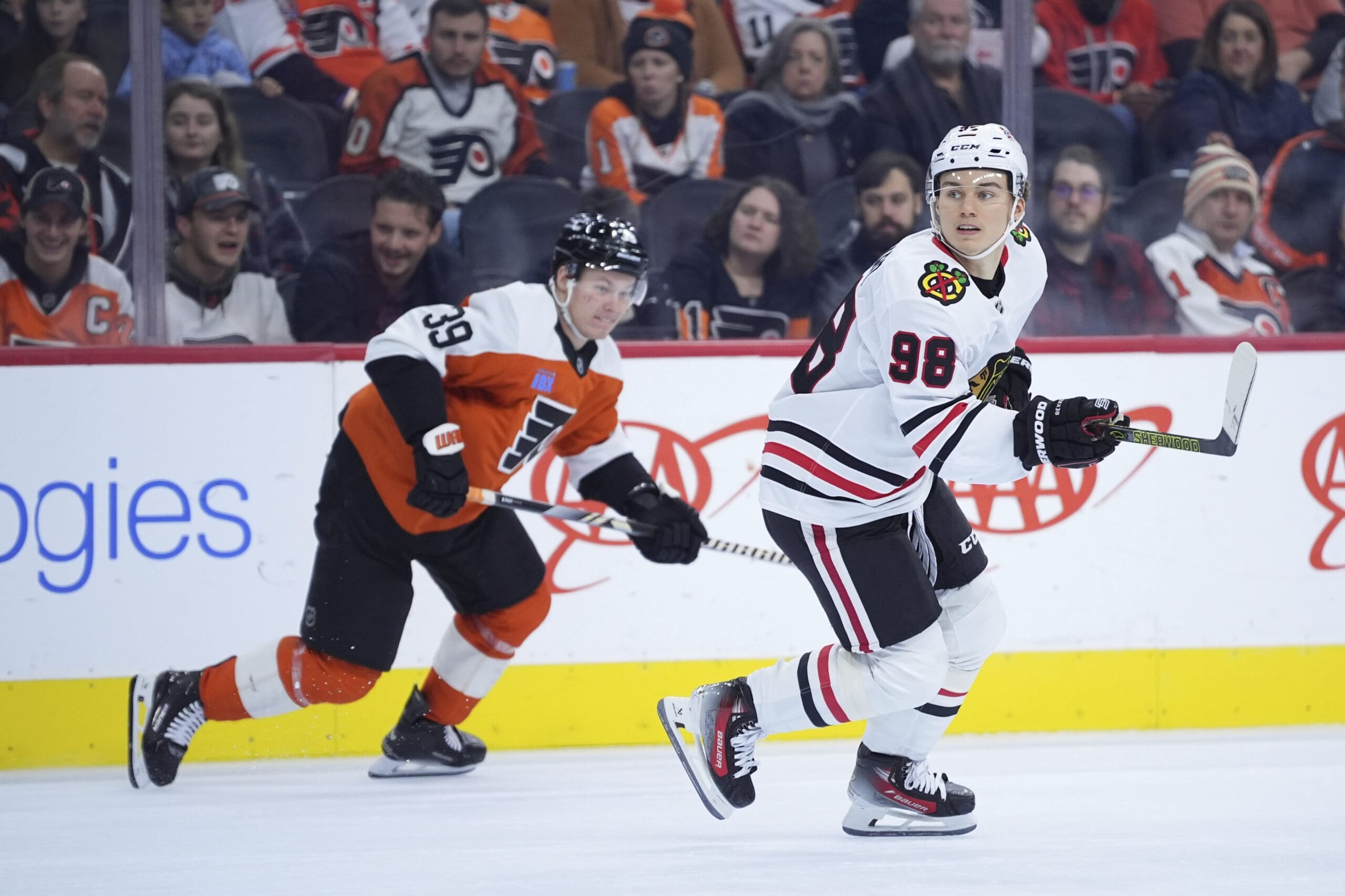 Philadelphia Flyers forward Matvei Michkov pursues Chicago Blackhawks forward Connor Bedard