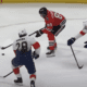 Blackhawks' Andreas Athanasiou holds the puck in the offensive zone against the Florida Panthers.