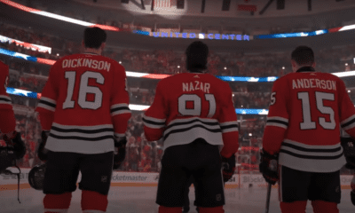 Blackhawks players lineup for the national anthem.