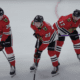 Ethan Del Mastro, #38, Philipp Kurashev #23 and Nick Foligno #17 await the faceoff in the defensive zone against the Nashville Predators.