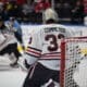 Drew Commesso #33 of the Rockford IceHogs takes in the game from the crease.