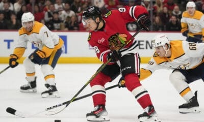 Chicago Blackhawks center Connor Bedard handles the puck during the first period of an NHL hockey game against the Nashville Predators, Friday, Oct. 25, 2024, in Chicago. (AP Photo/Erin Hooley)