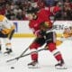 Chicago Blackhawks center Connor Bedard handles the puck during the first period of an NHL hockey game against the Nashville Predators, Friday, Oct. 25, 2024, in Chicago. (AP Photo/Erin Hooley)