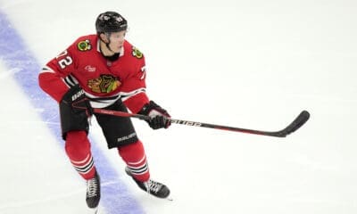 Chicago Blackhawks' Alex Vlasic keeps his eyes on the puck during an NHL hockey game against the Minnesota Wild on Friday, Oct. 4, 2024, in Chicago. (AP Photo/Charles Rex Arbogast)