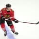 Chicago Blackhawks' Alex Vlasic keeps his eyes on the puck during an NHL hockey game against the Minnesota Wild on Friday, Oct. 4, 2024, in Chicago. (AP Photo/Charles Rex Arbogast)