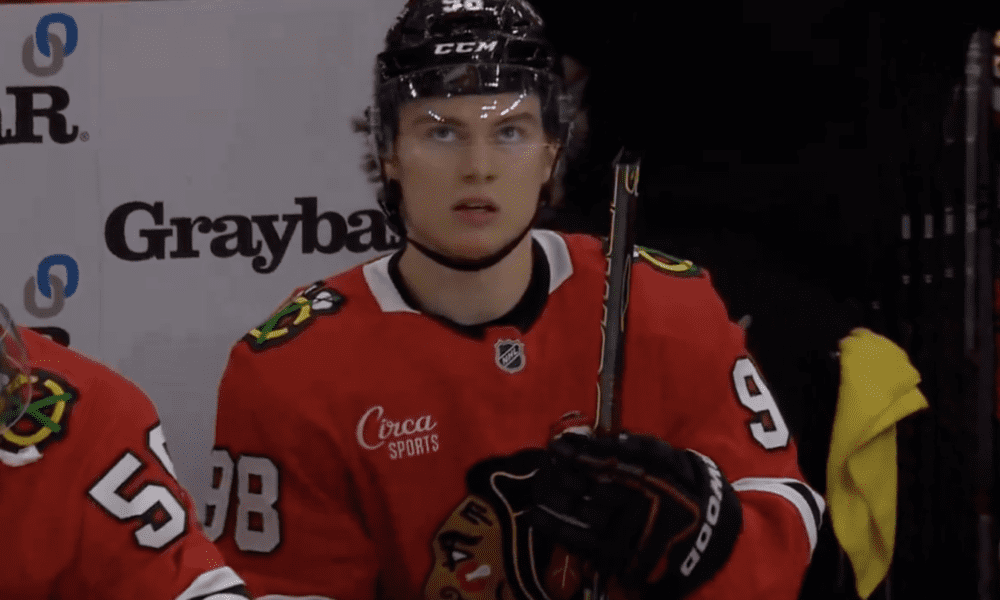 Connor Bedard breaks his stick on the bench during the Chicago Blackhawks 6-3 loss to the Vancouver Canucks.