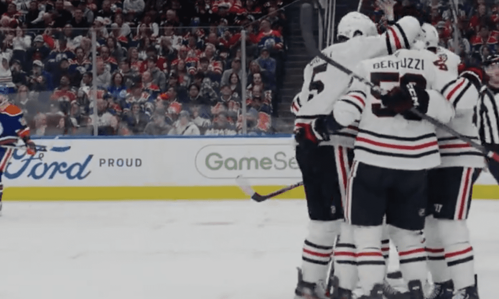 Philipp Kurashev #23 of the Chicago Blackhawks scores the team's first goal of the game against the Edmonton Oilers on Oct. 12, 2024.