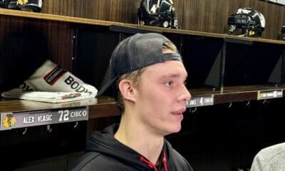 Alex Vlasic of the Chicago Blackhawks speaks with the media.