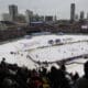 Fans cheer during the first period of the NHL Winter Classic hockey game between the Detroit Red Wings and the Chicago Blackhawks at Wrigley Field in Chicago, Jan. 1, 2009. (AP Photo/M. Spencer Green, File)