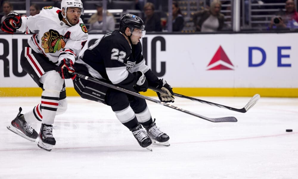 Los Angeles Kings left wing Kevin Fiala, right, shoots as Chicago Blackhawks defenseman Seth Jones defends during the second period of an NHL hockey game, Saturday, Nov. 2, 2024, in Los Angeles. (AP Photo/Ryan Sun)