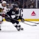 Los Angeles Kings left wing Kevin Fiala, right, shoots as Chicago Blackhawks defenseman Seth Jones defends during the second period of an NHL hockey game, Saturday, Nov. 2, 2024, in Los Angeles. (AP Photo/Ryan Sun)