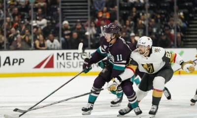 Anaheim Ducks center Trevor Zegras, left, and Vegas Golden Knights defenseman Shea Theodore vie for the puck during the first period of an NHL hockey game Sunday, Nov. 5, 2023, in Anaheim, Calif. (AP Photo/Ryan Sun)