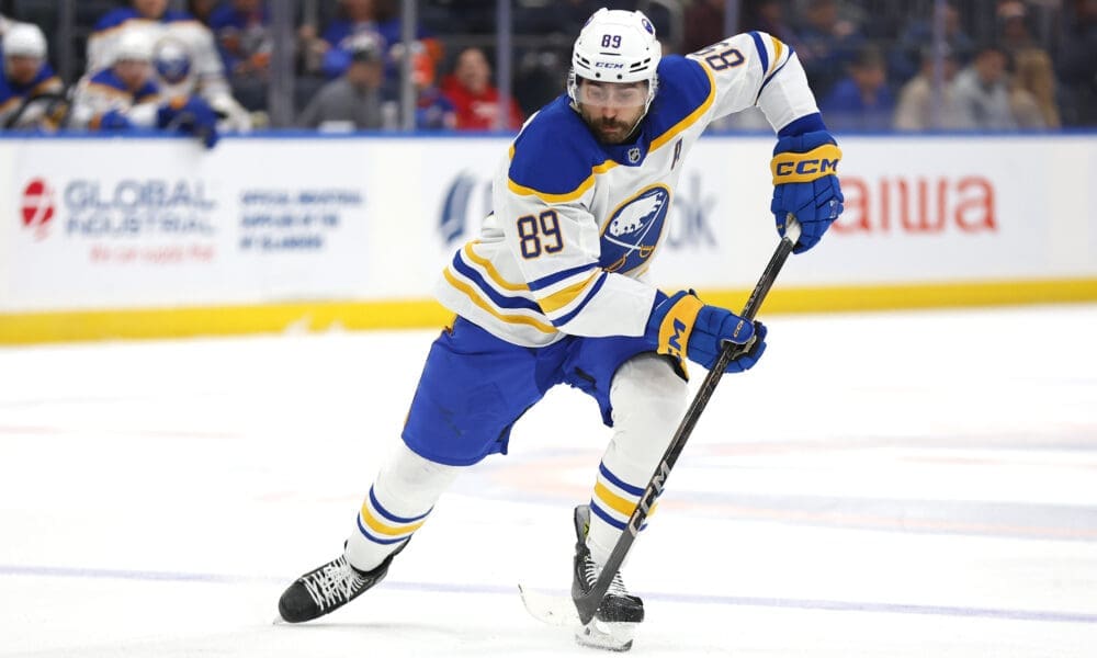 Buffalo Sabres right wing Alex Tuch (89) skates with the puck during the third period of an NHL hockey game against the New York Islanders, Saturday, Nov. 30, 2024, in Elmont, N.Y. (AP Photo/Noah K. Murray)