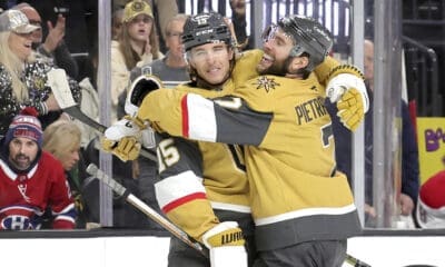 Vegas Golden Knights defenseman Noah Hanifin (15) celebrates with Vegas Golden Knights defenseman Alex Pietrangelo (7) after scoring a goal against the Montreal Canadiens during the first period of an NHL hockey game Tuesday, Dec. 31, 2024, in Las Vegas. (Steve Marcus/Las Vegas Sun via AP)