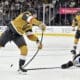 St. Louis Blues center Brayden Schenn (10) breaks up a shot by Vegas Golden Knights defenseman Shea Theodore, left, during the second period of an NHL hockey game Monday, Jan. 20, 2025, in Las Vegas. (AP Photo/David Becker)