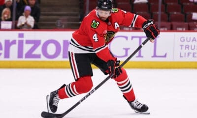 CHICAGO, IL - JANUARY 26: Seth Jones #4 of the Chicago Blackhawks controls the puck during the third period against the Minnesota Wild on January 26, 2025 at the United Center in Chicago, Illinois. (Photo by Melissa Tamez/Icon Sportswire)