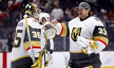 Vegas Golden Knights goaltender Ilya Samsonov, left, celebrates with goaltender Adin Hill after the team's win against the Anaheim Ducks during an NHL hockey game Wednesday, Dec. 4, 2024, in Anaheim, Calif. (AP Photo/Ryan Sun)