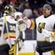 Vegas Golden Knights goaltender Ilya Samsonov, left, celebrates with goaltender Adin Hill after the team's win against the Anaheim Ducks during an NHL hockey game Wednesday, Dec. 4, 2024, in Anaheim, Calif. (AP Photo/Ryan Sun)