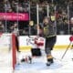 Vegas Golden Knights right wing Mark Stone, center, celebrates after scoring against New Jersey Devils goaltender Jacob Markstrom (25) during the third period of an NHL hockey game, Sunday, March 2, 2025, in Las Vegas. New Jersey Devils defenseman Brenden Dillon (5) looks on at right. (Steve Marcus/Las Vegas Sun via AP)