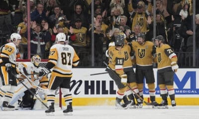 Vegas Golden Knights right wing Mark Stone, second from right, celebrates after scoring against the Pittsburgh Penguins during the third period of an NHL hockey game Friday, March 7, 2025, in Las Vegas. (AP Photo/John Locher)