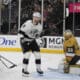 Los Angeles Kings right wing Adrian Kempe (9) scores against Vegas Golden Knights goaltender Adin Hill (33) during the third period of an NHL hockey game Sunday, March 9, 2025, in Las Vegas. (AP Photo/John Locher)