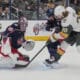 Vegas Golden Knights left wing Brandon Saad (20) shoots on Columbus Blue Jackets goaltender Elvis Merzlikins (90) next to defenseman Ivan Provorov (9) in the first period of an NHL hockey game Thursday, March 13, 2025, in Columbus, Ohio. (AP Photo/Sue Ogrocki)