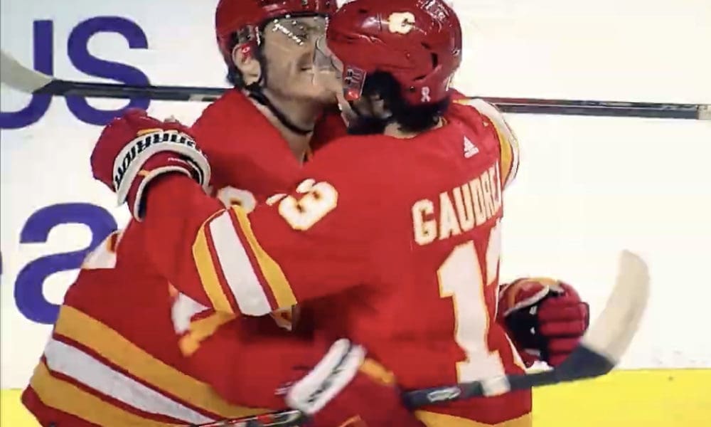 Calgary Flames' Martthew Tkachuk and Johnny Gaudreau celebrate Tkachuk's second of three goals against Seattle Kraken on April 12,2022. It was Johnny Gaudreau's 100th point of the season as he earned an assist on the play.