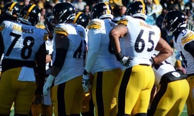 The Steelers offense huddles up as they played against the Carolina Panthers on Sunday, Dec. 18, 2022 at Bank of America Stadium in Charlotte. (Mitchell Northam / Steelers Now)
