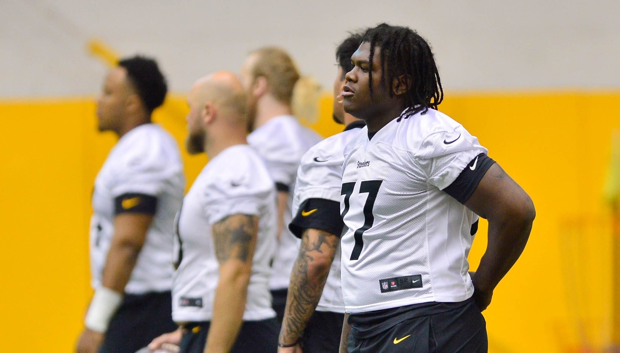 Pittsburgh Steelers offensive tackle Broderick Jones (77), the team's No. 1 draft  pick, warms up during the NFL football team's rookie minicamp in Pittsburgh,  Friday, May 12, 2023. (AP Photo/Gene J. Puskar