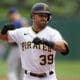 Pittsburgh Pirates' Nick Gonzales celebrates as he crosses home plate after hitting a two-run home run off Milwaukee Brewers starting pitcher Colin Rea during the second inning of a baseball game in Pittsburgh, Sunday, July 2, 2023. (AP Photo/Gene J. Puskar)