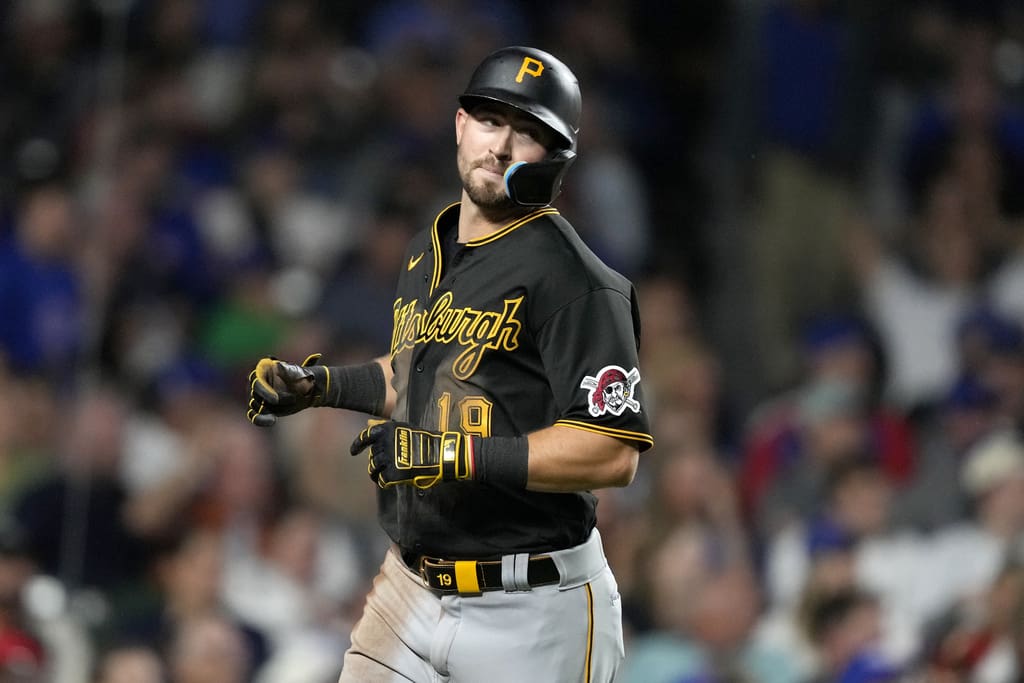 Pittsburgh Pirates' Jared Triolo scores during a baseball game against the Chicago Cubs Thursday, Sept. 21, 2023, in Chicago. (AP Photo/Charles Rex Arbogast)