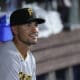 Pittsburgh Pirates second baseman Nick Gonzales looks out of the dugout before the start of a baseball game against the Miami Marlins, Friday, June 23, 2023, in Miami. (AP Photo/Wilfredo Lee)