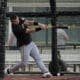 Pittsburgh Pirates catcher Henry Davis hits in the batting cage during a baseball spring training workout Saturday, Feb. 17, 2024, in Bradenton, Fla. (AP Photo/Charlie Neibergall)