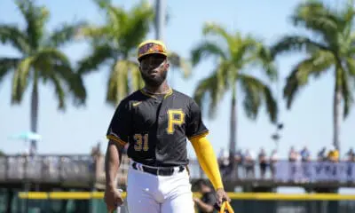 Pittsburgh Pirates second baseman Liover Peguero (31) walks on the field before a spring training baseball game against the Atlanta Braves Tuesday, Feb. 27, 2024, in Bradenton, Fla. (AP Photo/Charlie Neibergall)