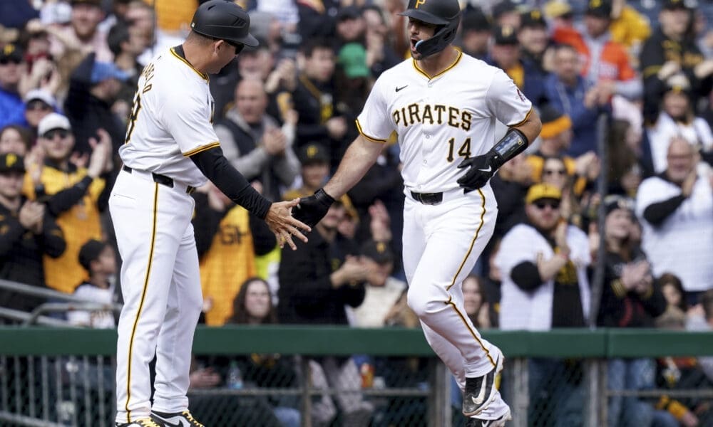 Pittsburgh Pirates' Joey Bart, right, is greeted by third base coach Mike Rabelo, left, after hitting a home run during the second inning of a baseball game against the Baltimore Orioles, Saturday, April 6, 2024, in Pittsburgh. (AP Photo/Matt Freed)