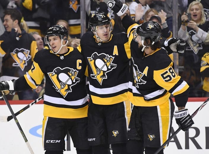Pittsburgh Penguins Evgeni Malkin celebrates with Kris Letang and Sidney Crosby