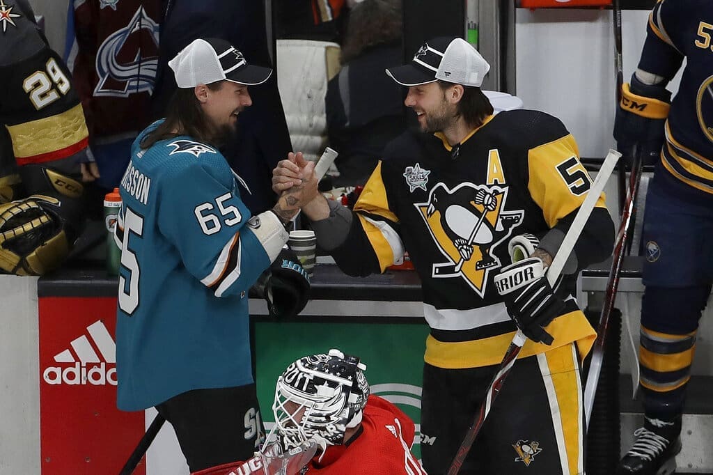 Pittsburgh Penguins trade, Erik Karlsson, NHL trade rumors. Kris Letang shakes hands with Karlsson at ASG