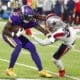 Minnesota Vikings wide receiver Jalen Reagor gets taken down by the New England Patriots defender