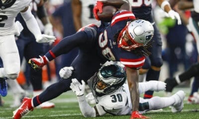 New England Patriots running back Rhamondre Stevenson (38) is tackled by Philadelphia Eagles safety Justin Evans (30)during the second half of an NFL football game, Sunday, Sept. 10, 2023, in Foxborough, Mass. (AP Photo/Greg M. Cooper)