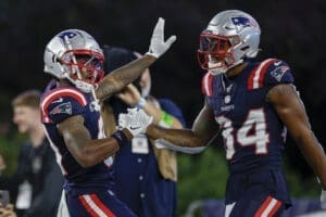 New England Patriots wide receiver Kendrick Bourne (84) celebrates with wide receiver Demario Douglas (81) after a touchdown during the second half of an NFL football game against the Philadelphia Eagles, Sunday, Sept. 10, 2023, in Foxborough, Mass. (AP Photo/Greg M. Cooper)