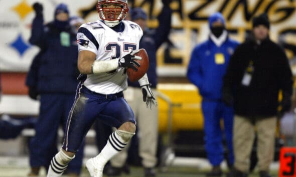 New England Patriots' Rodney Harrison returns an interception 87 yards for a touchdown in the second quarter of the AFC Championship game against the Pittsburgh Steelers Sunday, Jan. 23, 2005, in Pittsburgh. He is one of 25 semifinalists for the Pro Football Hall of Fame Class of 2024. (AP Photo/Stephan Savoia)