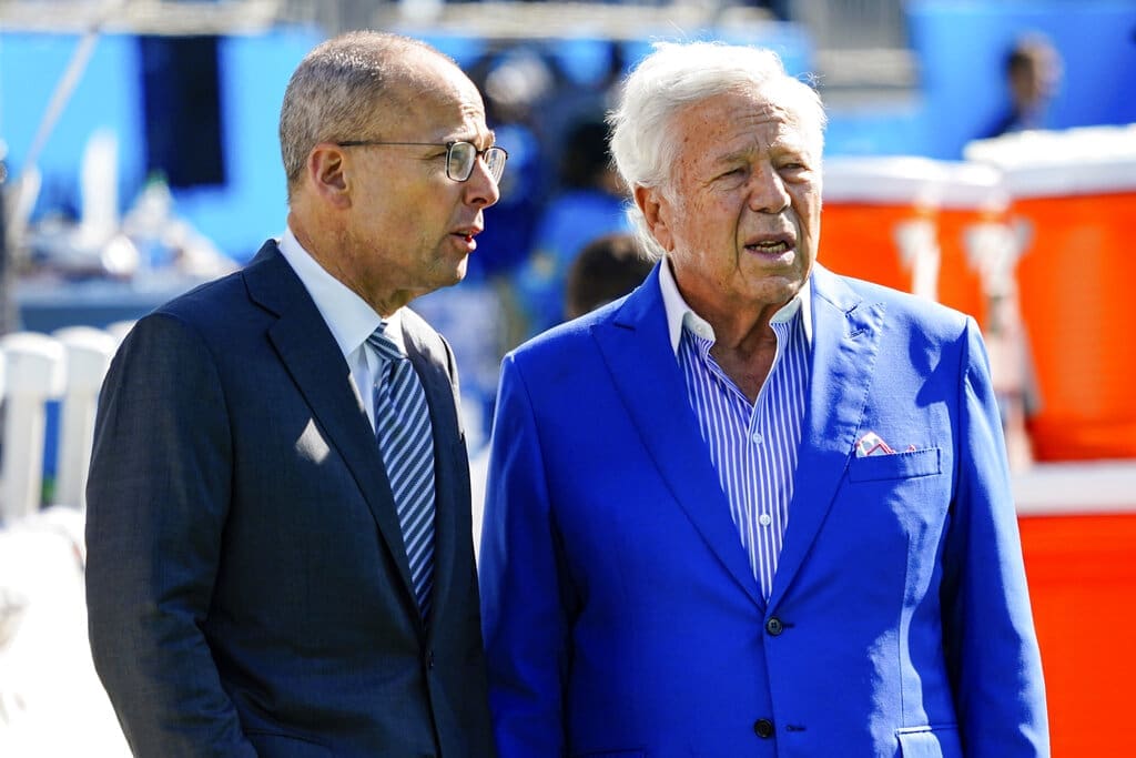 President of the New England Patriots Jonathan Kraft, left, looks on with owner Robert Kraft, right, before the first half of an NFL football game between the Carolina Panthers and the New England Patriots Sunday, Nov. 7, 2021, in Charlotte, N.C. The Krafts will need to decide on the future of Patriots head coach Bill Belichick. (AP Photo/Jacob Kupferman)