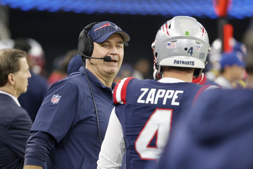 New England Patriots offensive coordinator Bill O'Brien, left, talks to quarterback Bailey Zappe (4) during an NFL Football game in Arlington, Texas, Sunday, Nov. 1, 2023. (AP Photo/Michael Ainsworth)