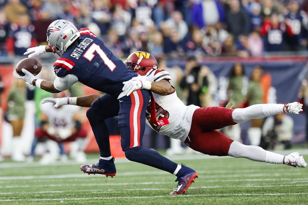 New England Patriots wide received JuJu Smith-Schuster attempts to bring in a pass from Mac Jones