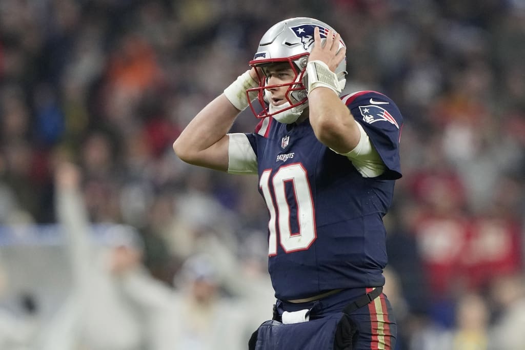 New England Patriots quarterback Mac Jones (10) reacts after throwing an interception during an NFL football game between the New England Patriots and the Indianapolis Colts at Deutsche Bank Park Stadium in Frankfurt, Germany, Sunday, Nov. 12, 2023. (AP Photo/Steve Luciano)