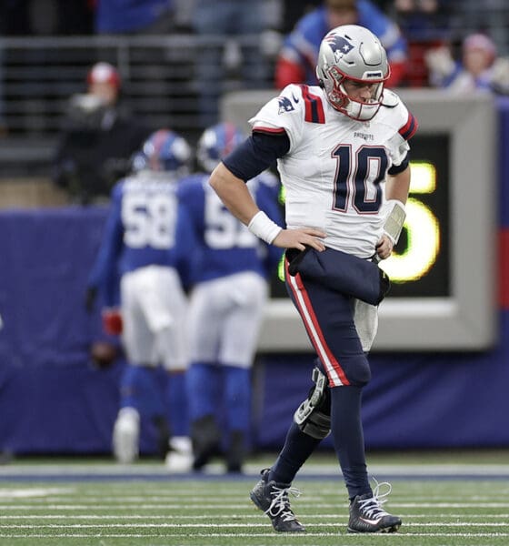 New England Patriots quarterback Mac Jones (10) walks off the field after throwing an interception against the New York Giants during the second quarter of an NFL football game, Sunday, Nov. 26, 2023, in East Rutherford, N.J. (AP Photo/Adam Hunger)