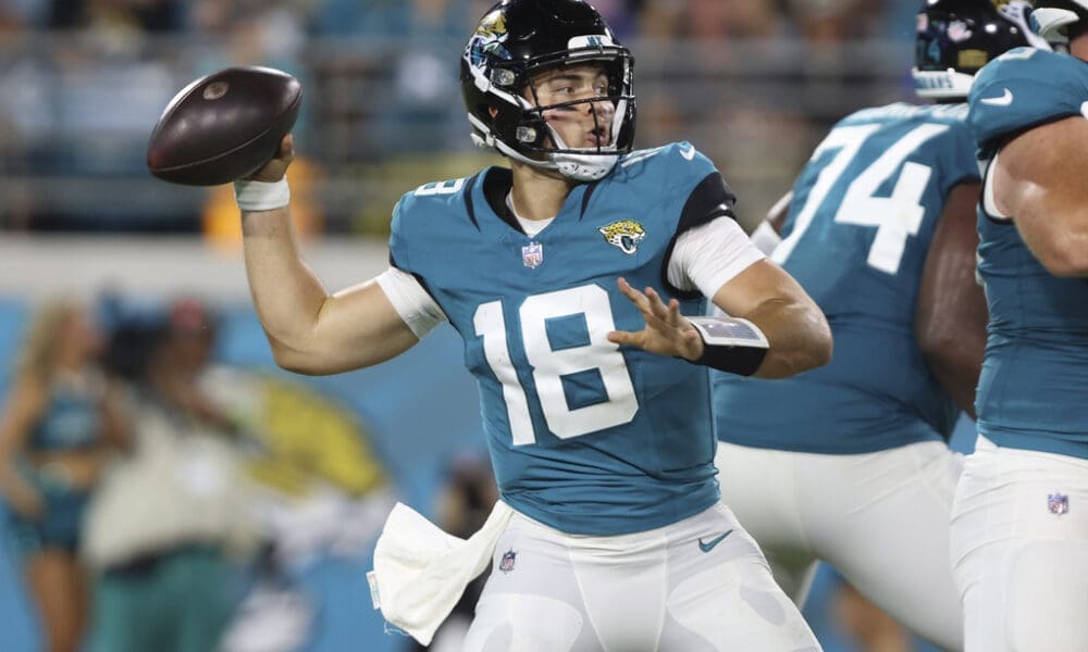 Jacksonville Jaguars quarterback Nathan Rourke (18) stands back to pass during the second half of an NFL preseason football game against the Miami Dolphins, Saturday, Aug. 26, 2023, in Jacksonville, Fla. (AP Photo/Gary McCullough)